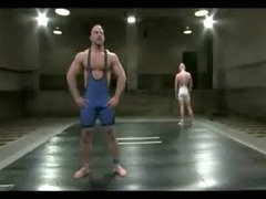 two bodybuilders fight balls to the wall and